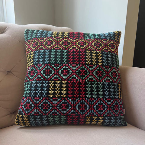 Decorative pillow with geometric pattern on a beige sofa