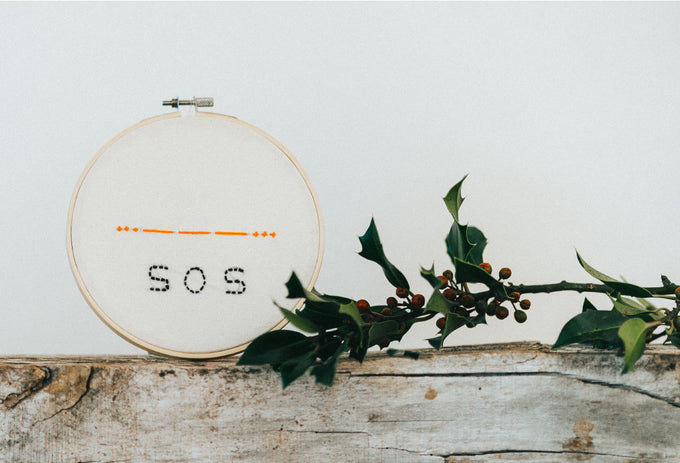 The SOS message woven into the fabric of Love Welcomes