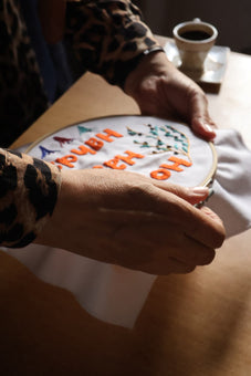 Embroidered "To Grow and Not Falter" House Art by Refugee Women | Joy is Resistance